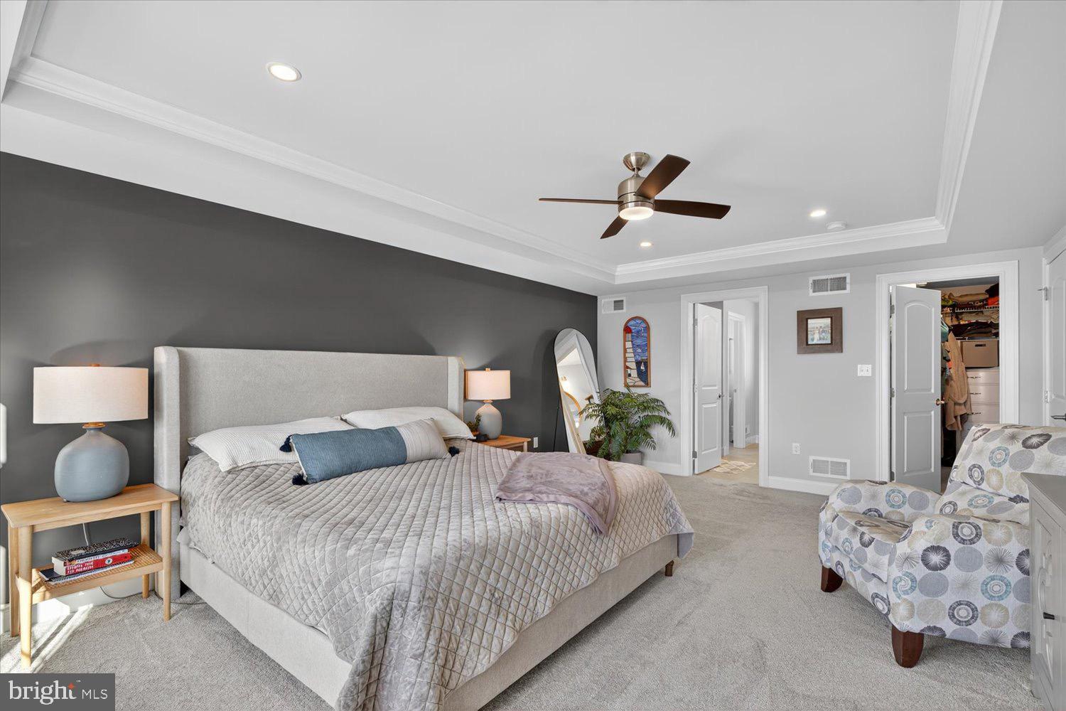 311 Ecker Drive Lititz, PA 17543 - Photo 24 of 49 a bedroom with bed and a chandelier