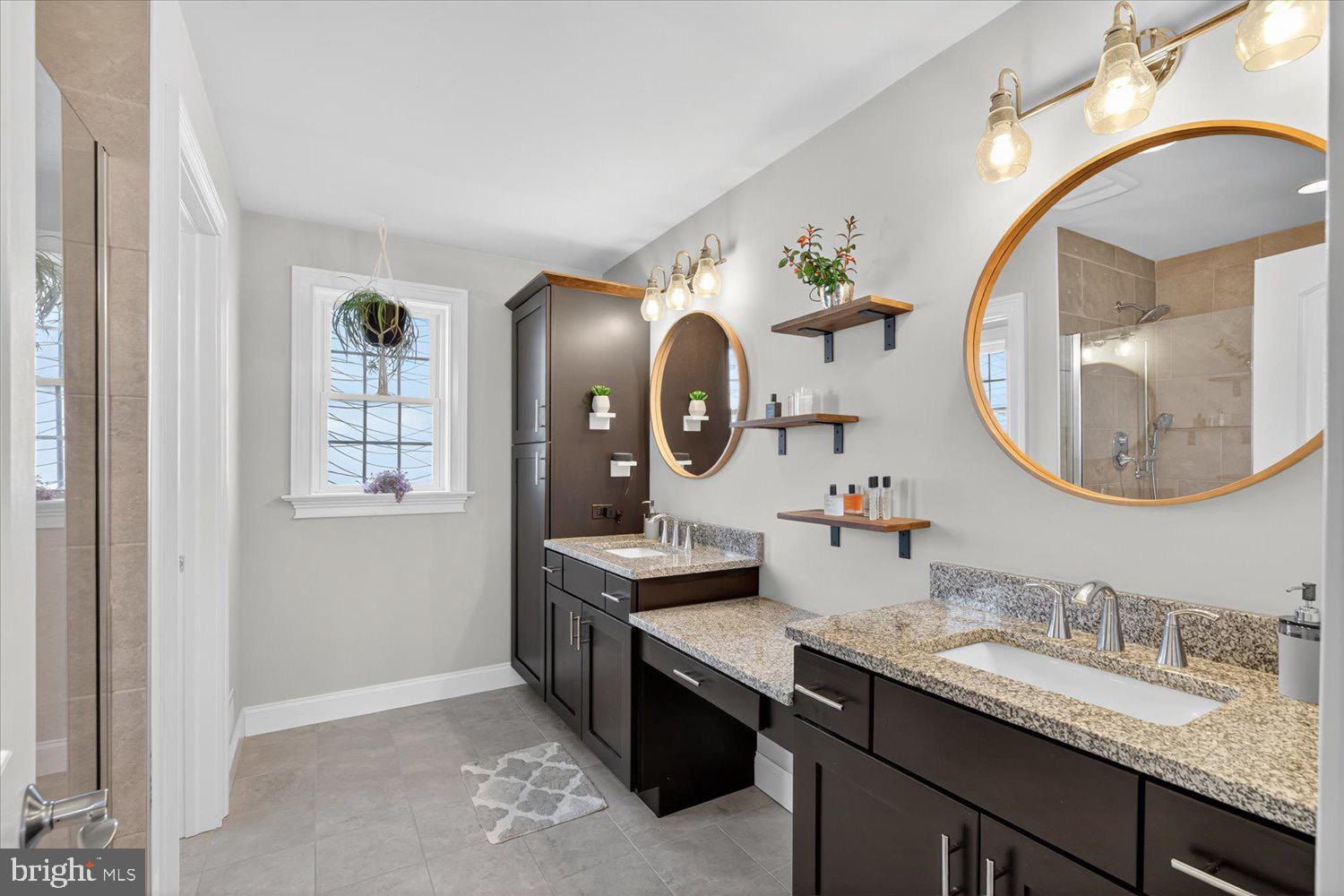 311 Ecker Drive Lititz, PA 17543 - Photo 25 of 49 a bathroom with a granite countertop double vanity sinks and a mirror