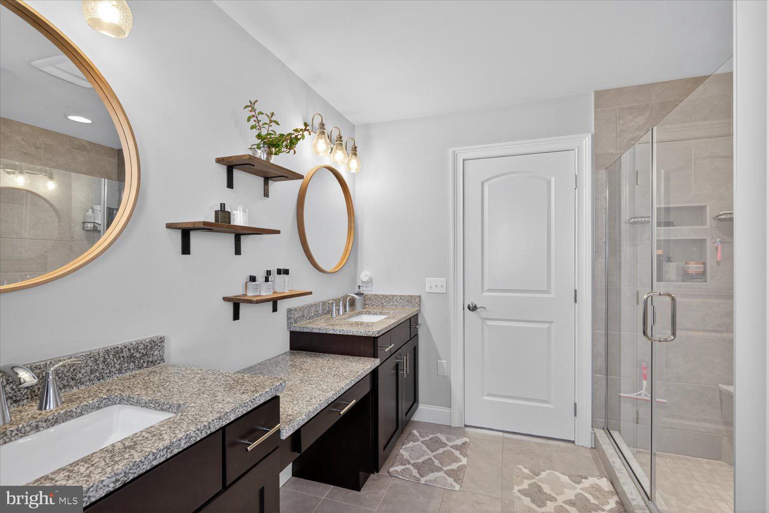 311 Ecker Drive Lititz, PA 17543 - Photo 27 of 49 a bathroom with a granite countertop sink a mirror and a vanity