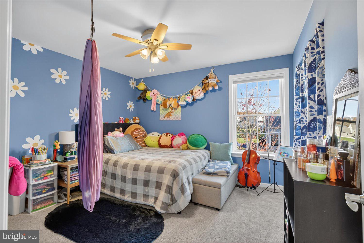 311 Ecker Drive Lititz, PA 17543 - Photo 32 of 49 a bedroom with a bed and a chandelier