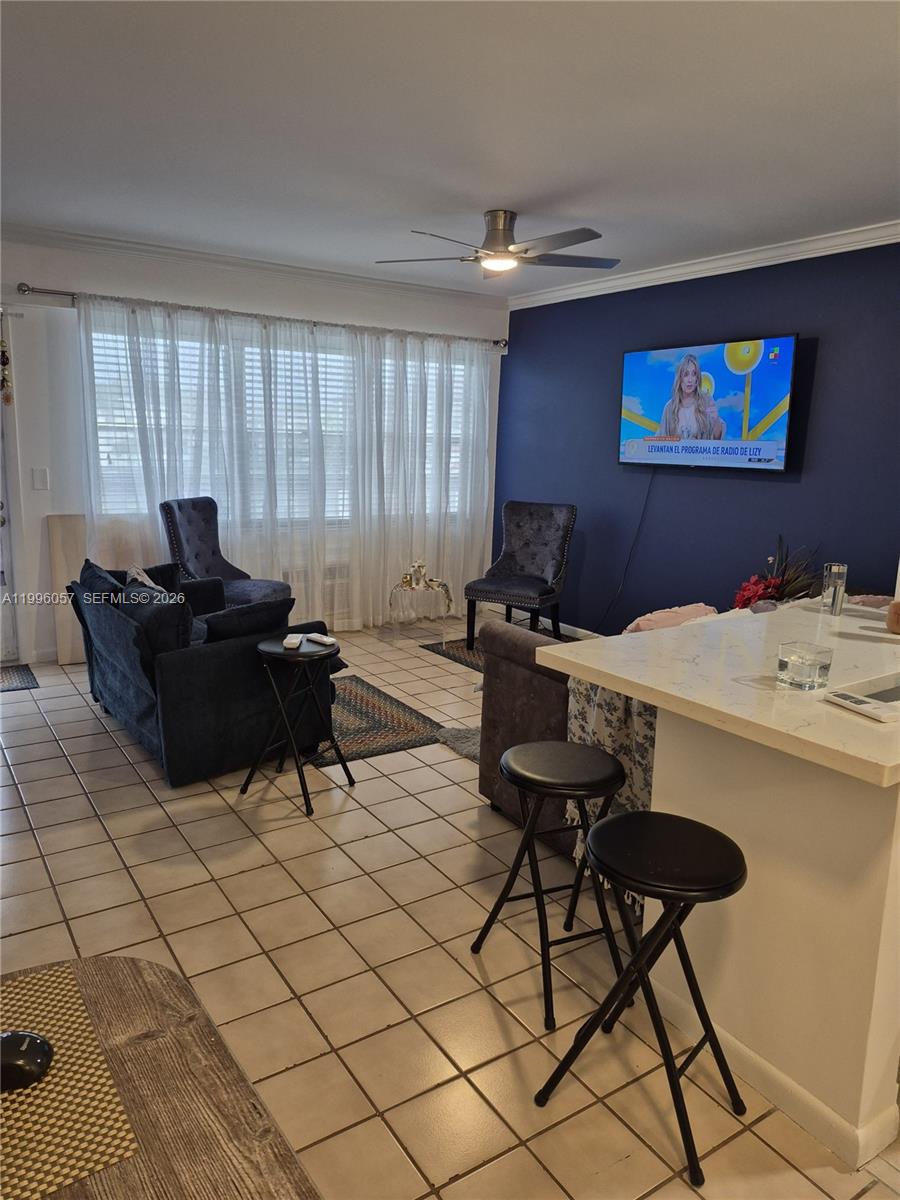 371 Brighton I, Unit 371 Boca Raton, FL 33434 - Photo 13 of 37 a living room with furniture a rug and a window