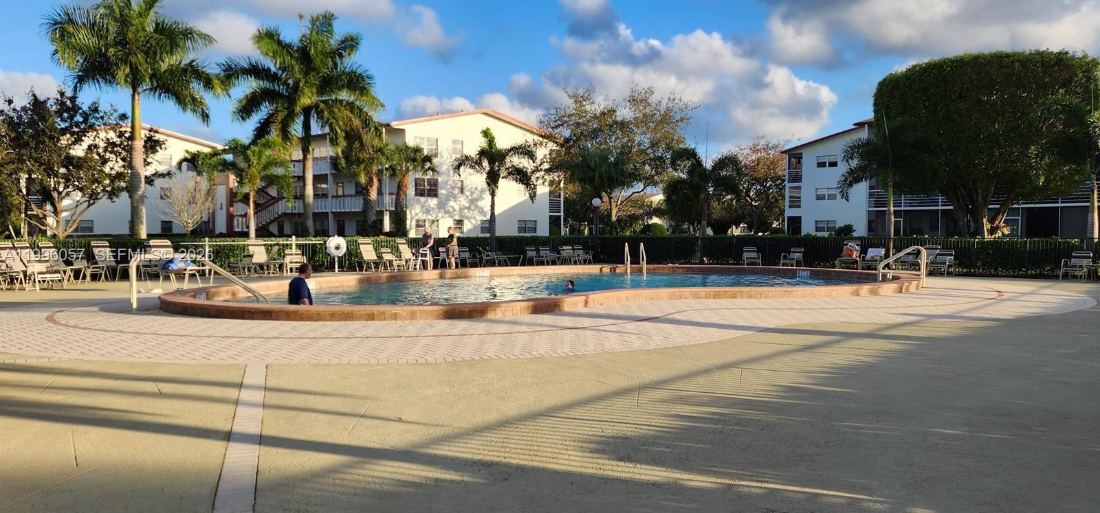 371 Brighton I, Unit 371 Boca Raton, FL 33434 - Photo 26 of 37 a view of a yard with a fountain