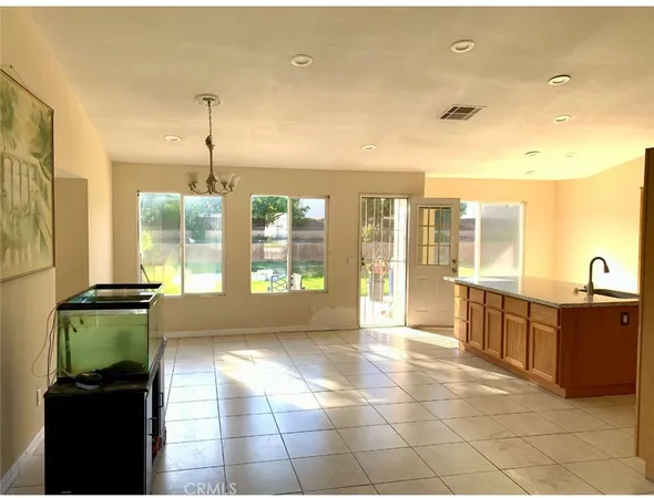 a view of a kitchen with a large window