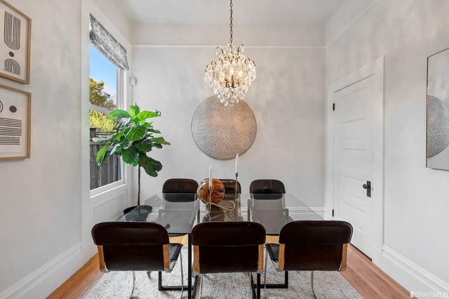 a view of a livingroom with furniture and a potted plant