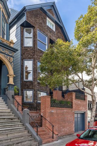 a front view of a house with stairs