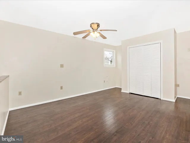 a dining room with furniture and a window