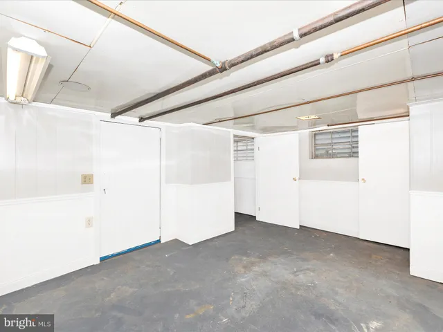 a view of a brick house with many windows