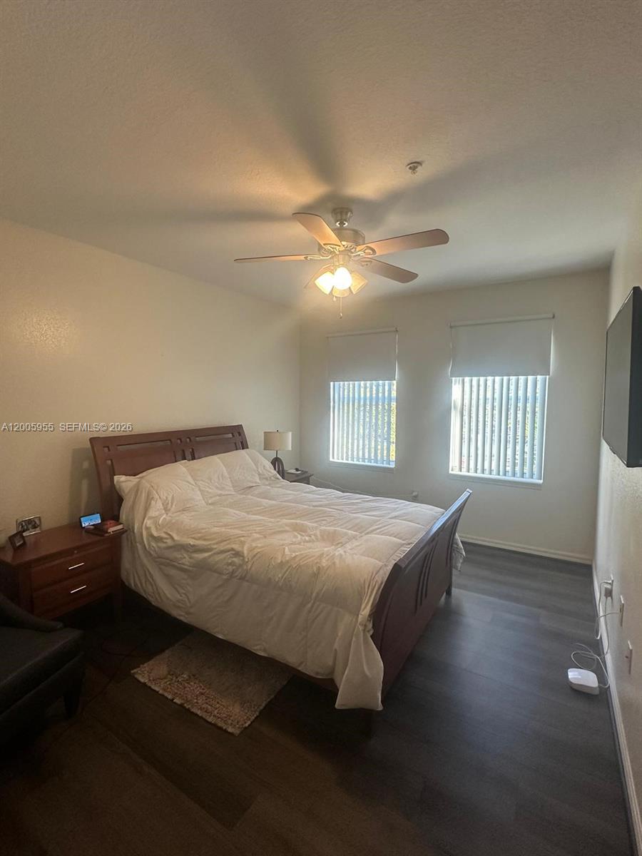 6920 West Sample Road, Unit 6920 Pompano Beach, FL 33063 - Photo 14 of 30 a bedroom with a bed and a window