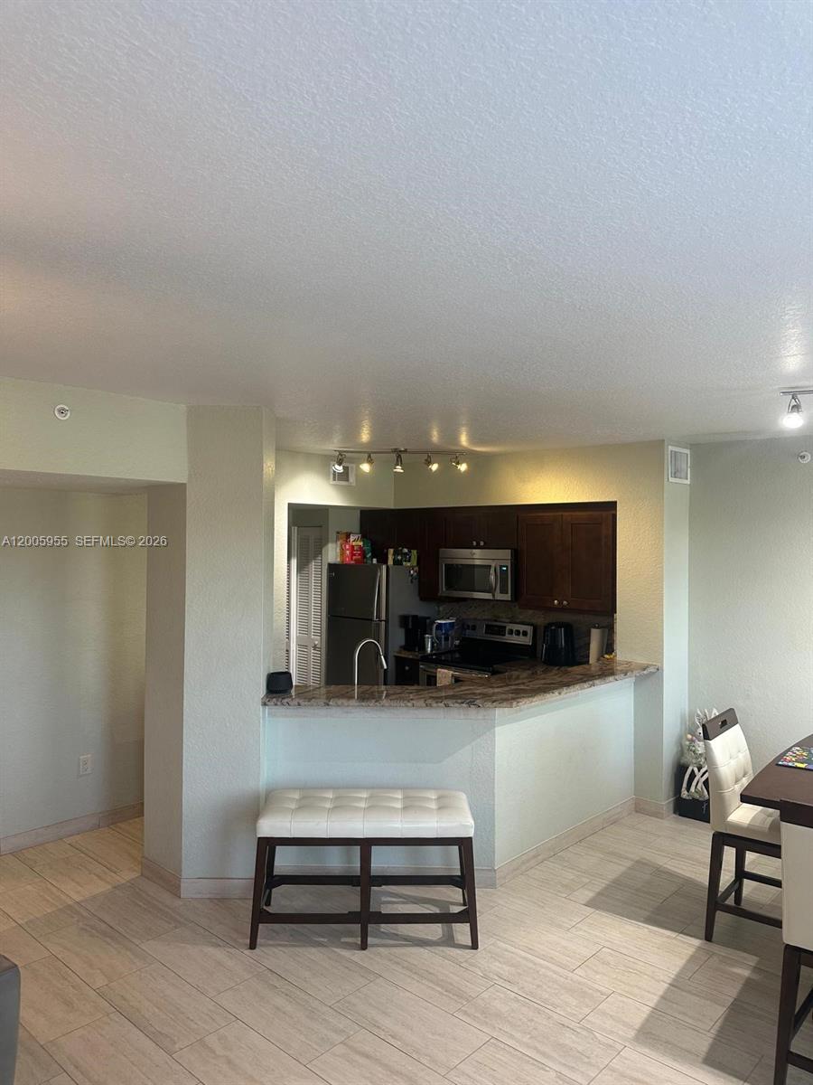 6920 West Sample Road, Unit 6920 Pompano Beach, FL 33063 - Photo 18 of 30 a view of livingroom with furniture and wooden floor