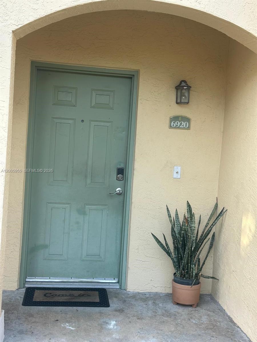 6920 West Sample Road, Unit 6920 Pompano Beach, FL 33063 - Photo 4 of 30 a view of a potted plant in a bathroom