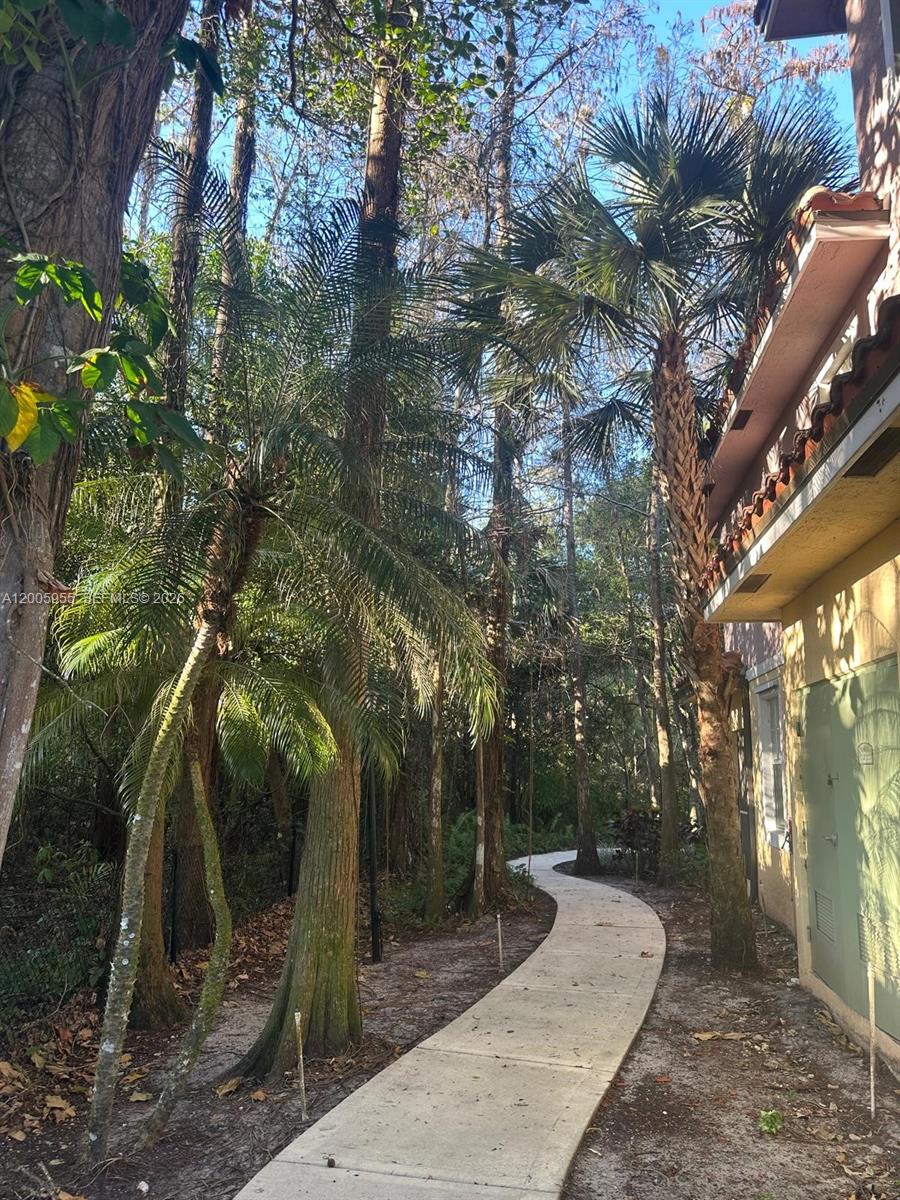 6920 West Sample Road, Unit 6920 Pompano Beach, FL 33063 - Photo 5 of 30 a backyard with lots of green space