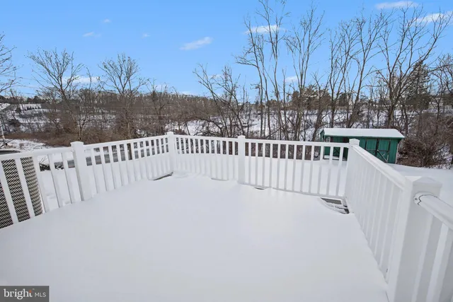 a view of a house with a backyard and a tree
