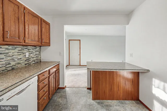a kitchen with a cabinets and chandelier