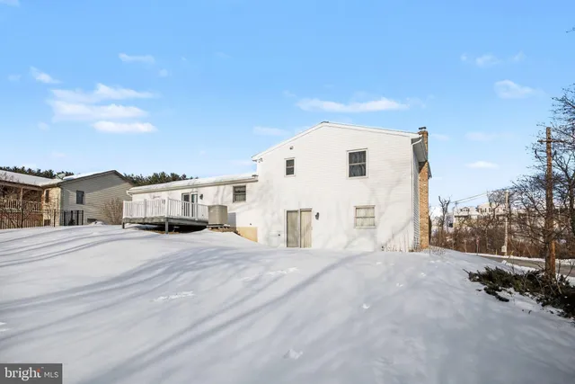 a view of backyard with a white fence