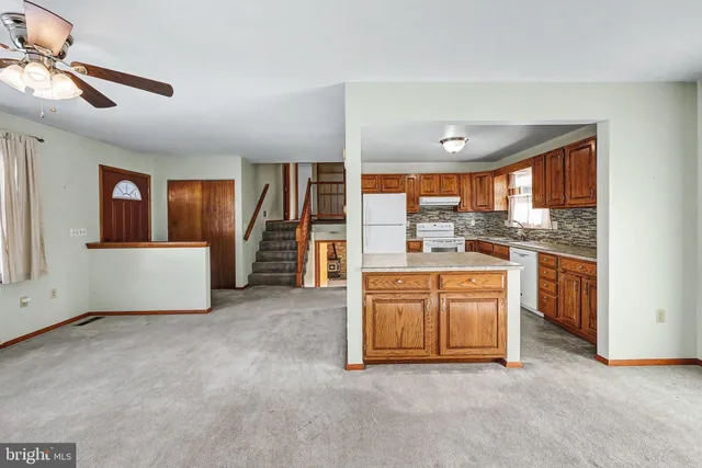a view of a kitchen with microwave and a stove