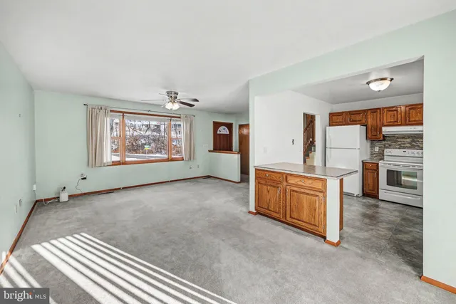 a view of a kitchen with a sink cabinets and a window