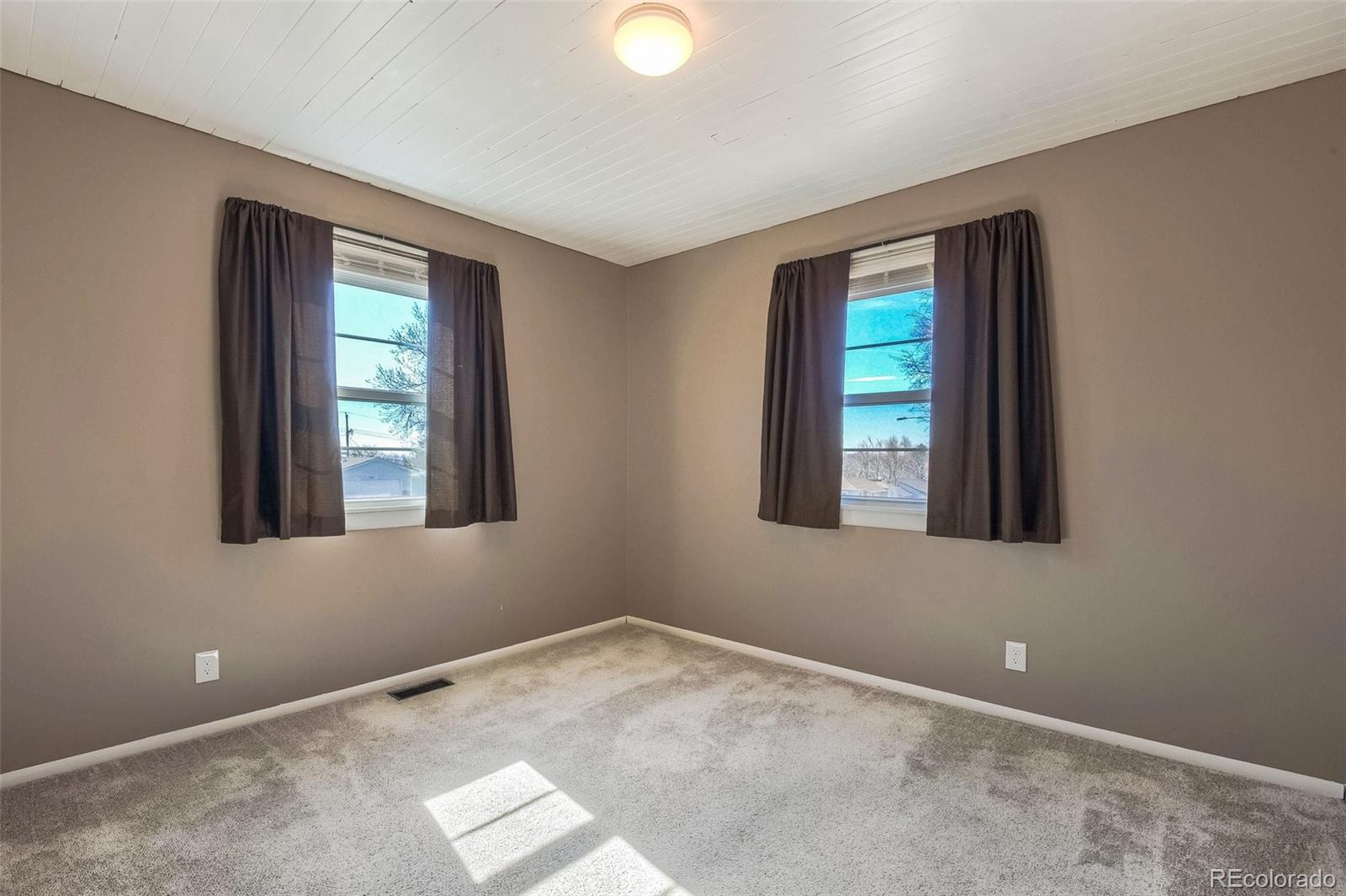 8941 Lilly Drive Thornton, CO 80229 - Photo 13 of 27 a view of an empty room with a window