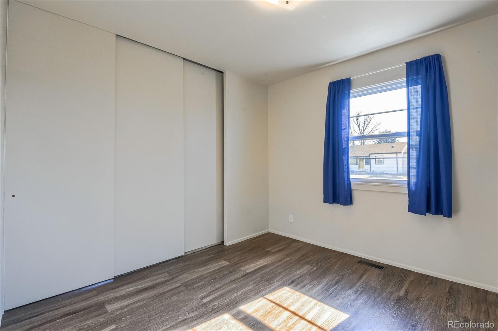 8941 Lilly Drive Thornton, CO 80229 - Photo 16 of 27 a view of an empty room and window