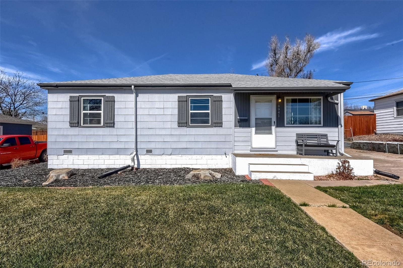 8941 Lilly Drive Thornton, CO 80229 - Photo 2 of 27 a front view of a house with garden