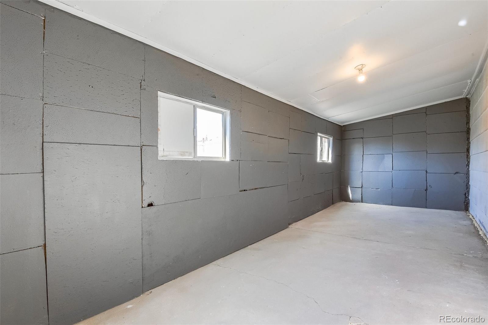 8941 Lilly Drive Thornton, CO 80229 - Photo 22 of 27 a big room with closet and windows