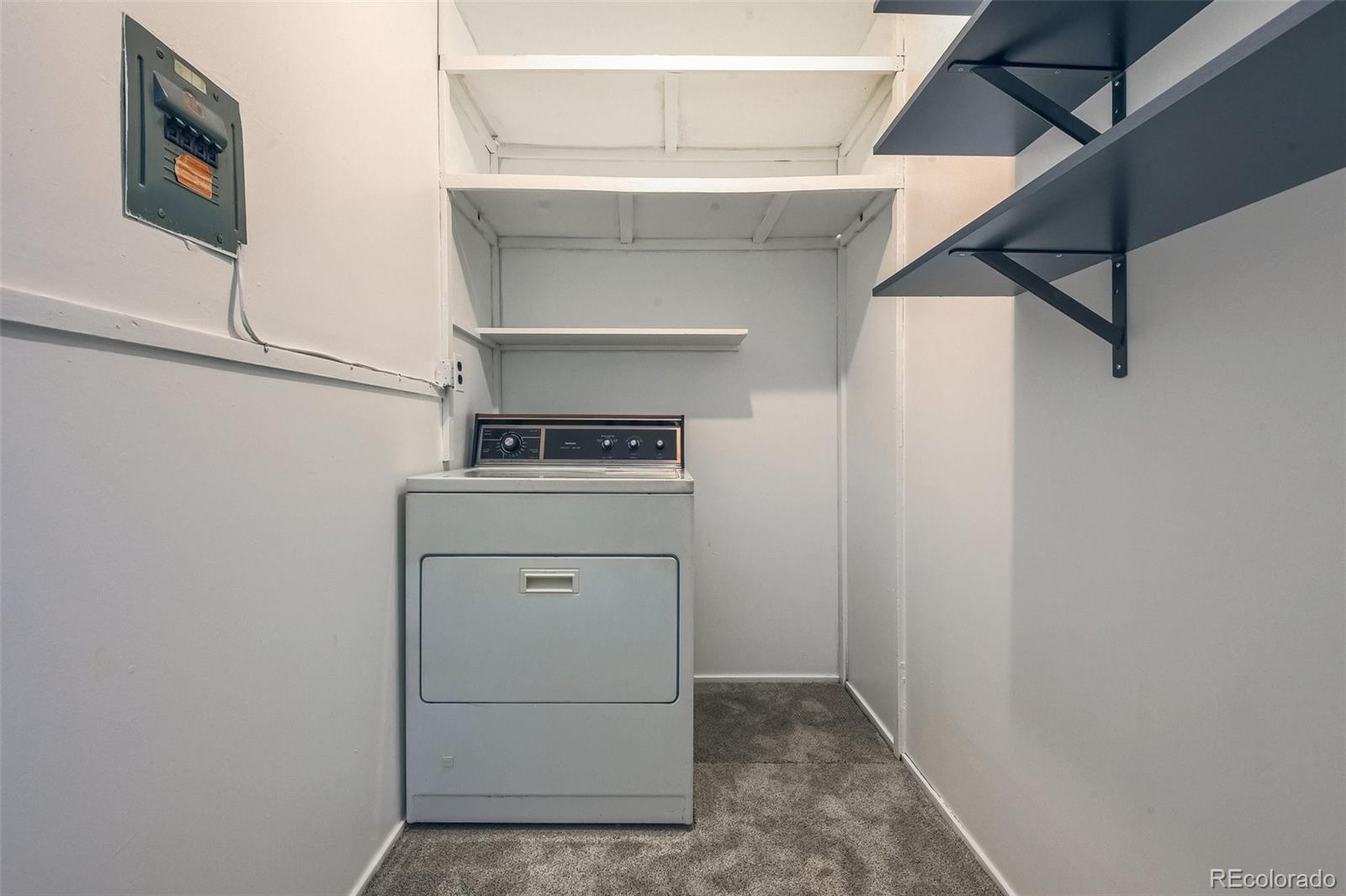 8941 Lilly Drive Thornton, CO 80229 - Photo 24 of 27 a utility room with dryer and washer