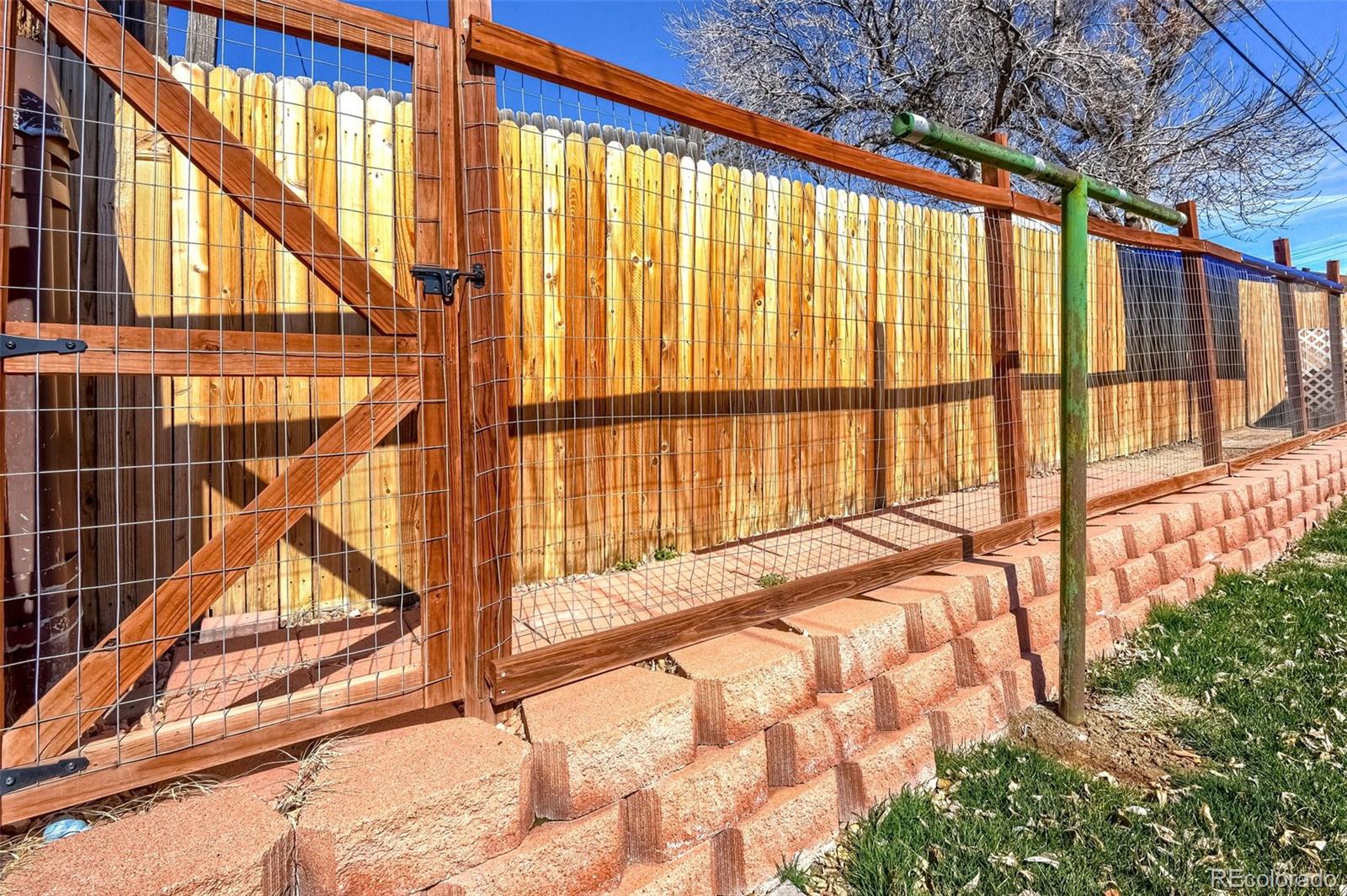 8941 Lilly Drive Thornton, CO 80229 - Photo 27 of 27 a view of outdoor space with wooden floor and fence