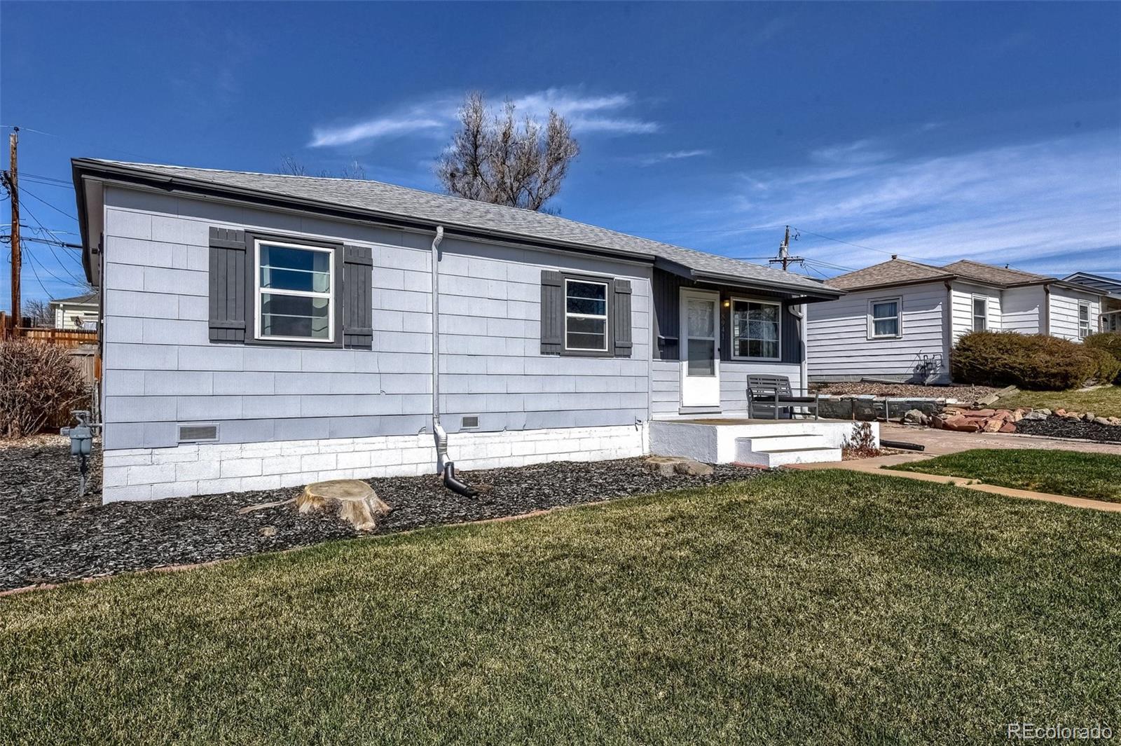 8941 Lilly Drive Thornton, CO 80229 - Photo 3 of 27 a front view of a house with a yard