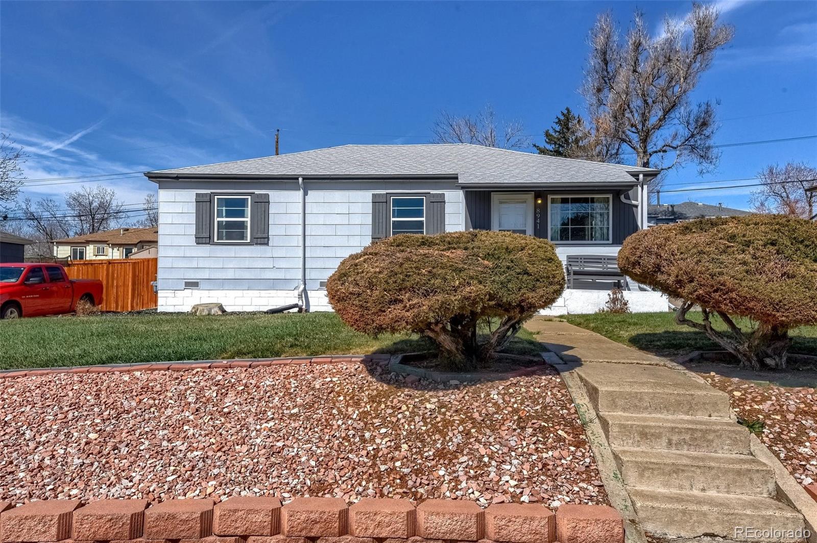 8941 Lilly Drive Thornton, CO 80229 - Photo 4 of 27 a front view of a house with a yard