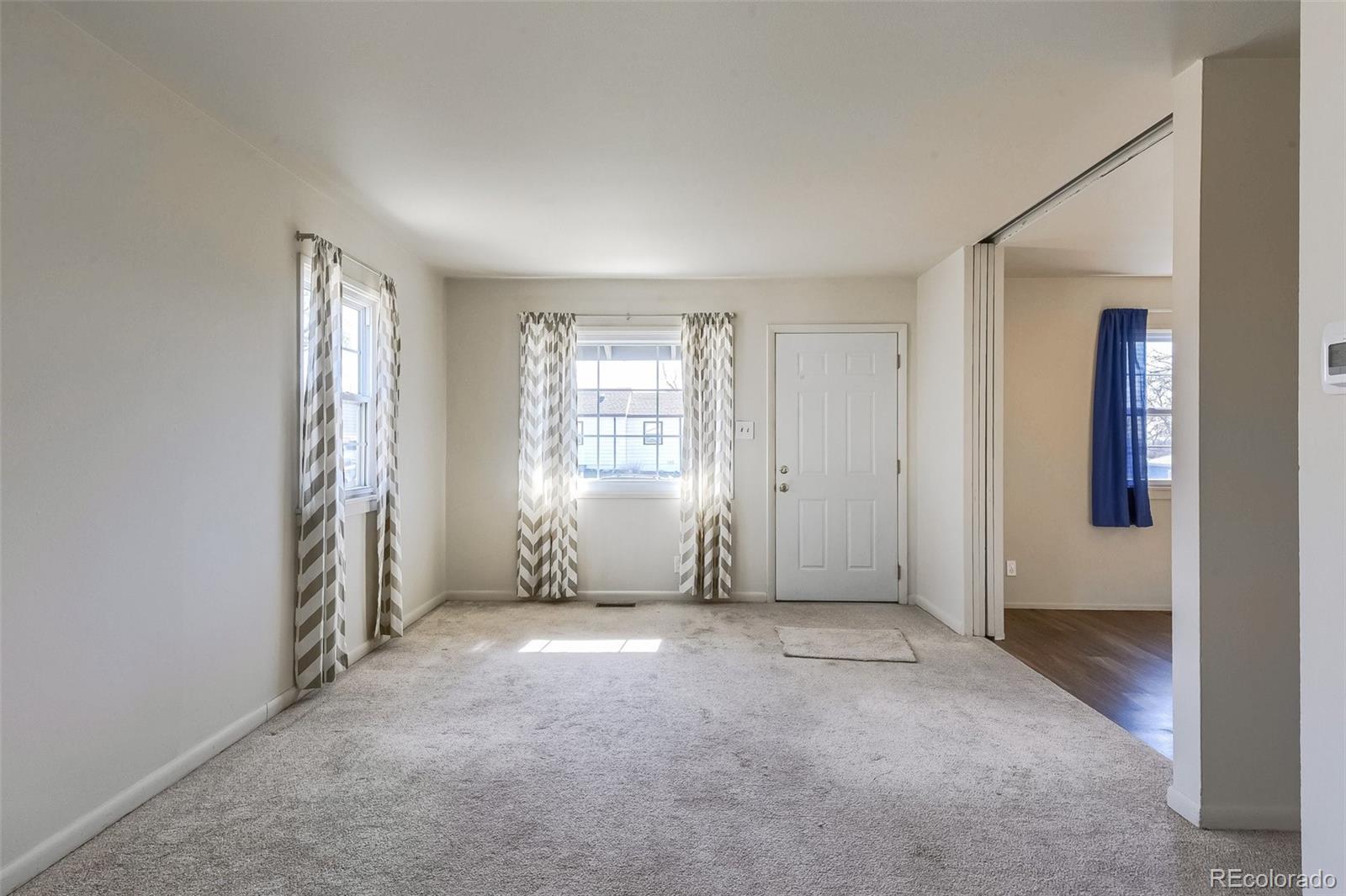8941 Lilly Drive Thornton, CO 80229 - Photo 8 of 27 an empty room with windows