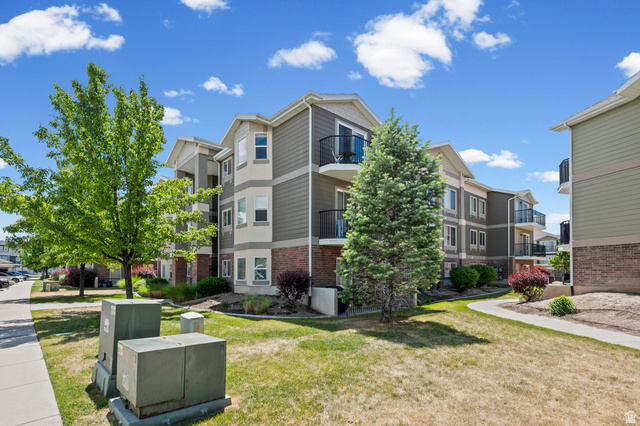 8248 South Resaca Drive, Unit J10 Sandy, UT 84070 - Photo 36 of 40 Contemporary multi-story building featuring composite siding and brick veneer