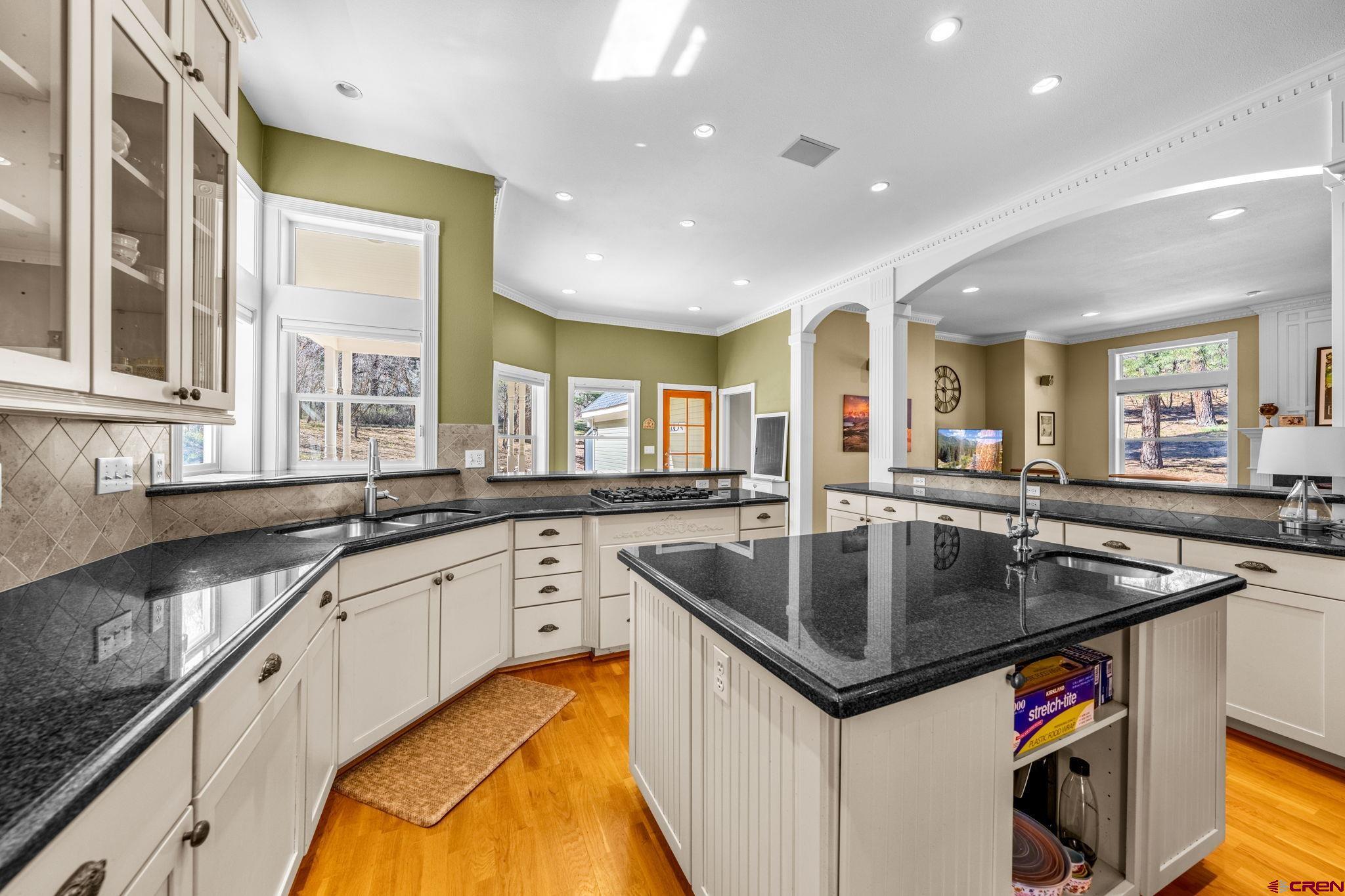823 The Eagle Pass Durango, CO 81301 - Photo 13 of 42 a kitchen with stainless steel appliances granite countertop a sink and a large window