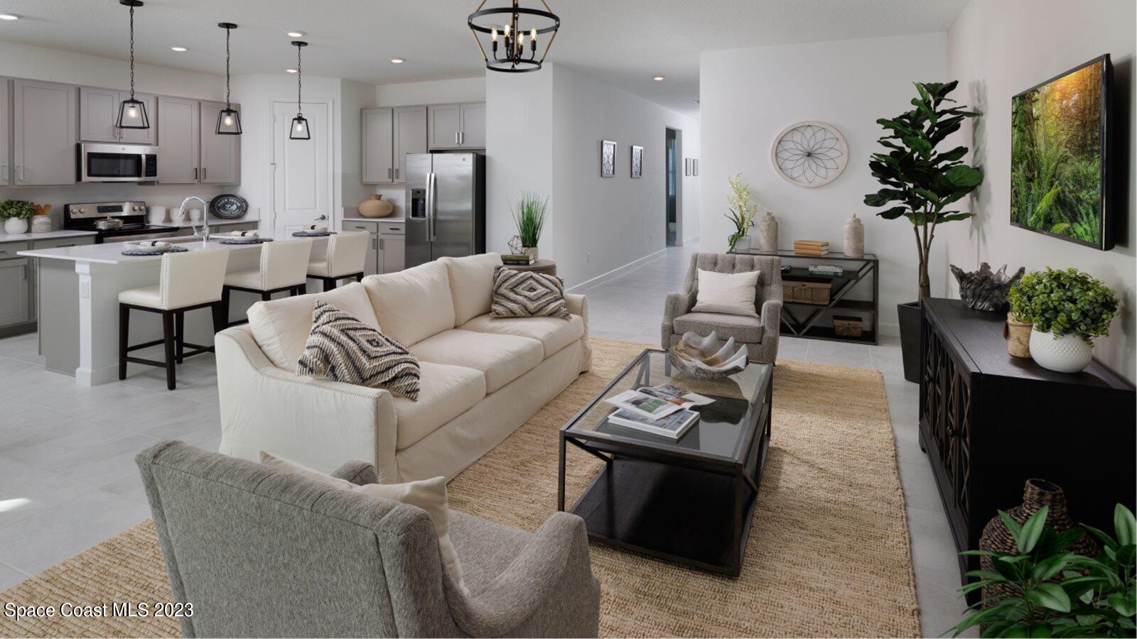 724 Veridian Circle Northwest Palm Bay, FL 32907 - Photo 4 of 10 a living room with furniture and a flat screen tv