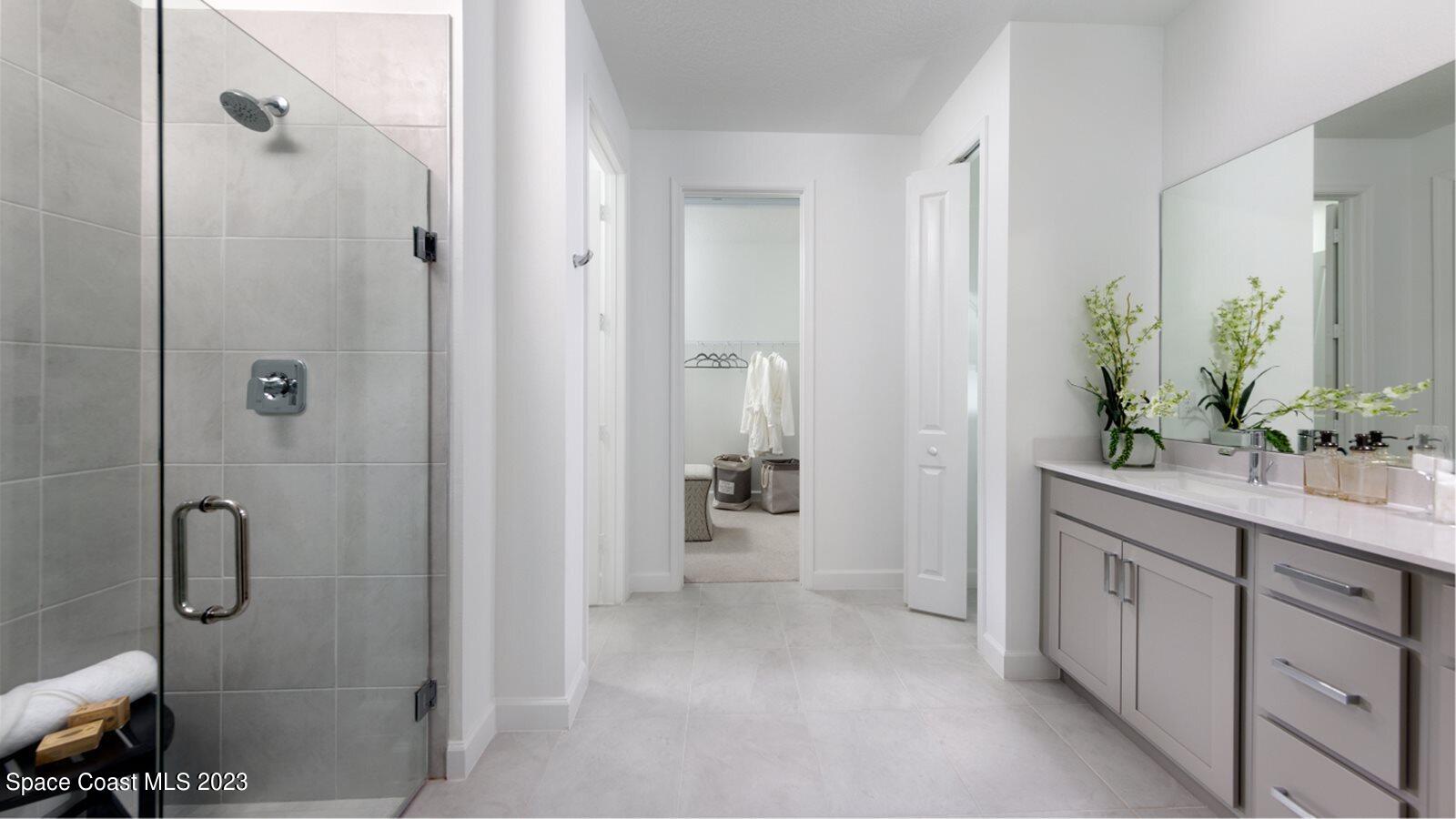 724 Veridian Circle Northwest Palm Bay, FL 32907 - Photo 7 of 10 a bathroom with a shower sink and mirror