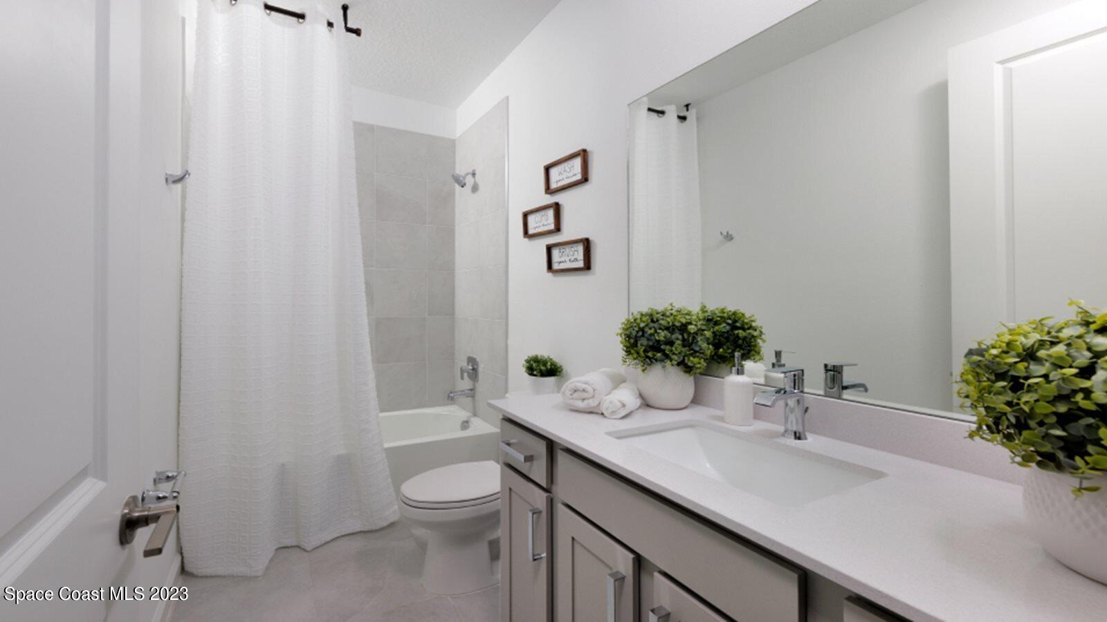 724 Veridian Circle Northwest Palm Bay, FL 32907 - Photo 9 of 10 a bathroom with a sink toilet and shower