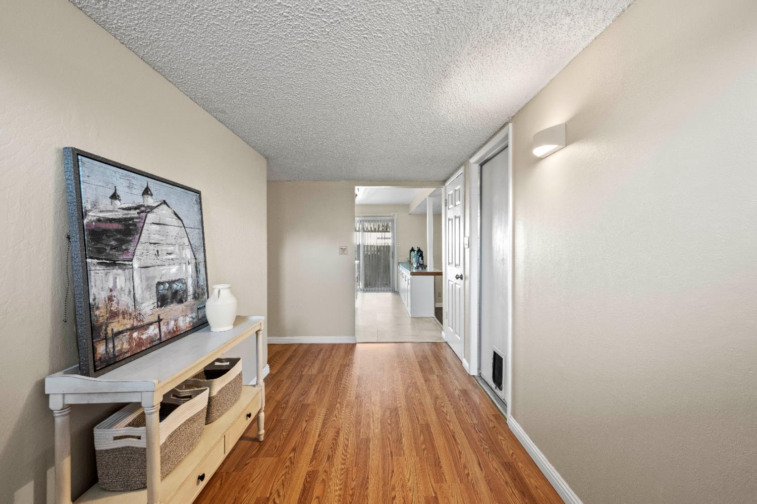 325 Archway Avenue Rio Linda, CA 95673 - Photo 3 of 29 a view of a hallway with wooden floor and furniture