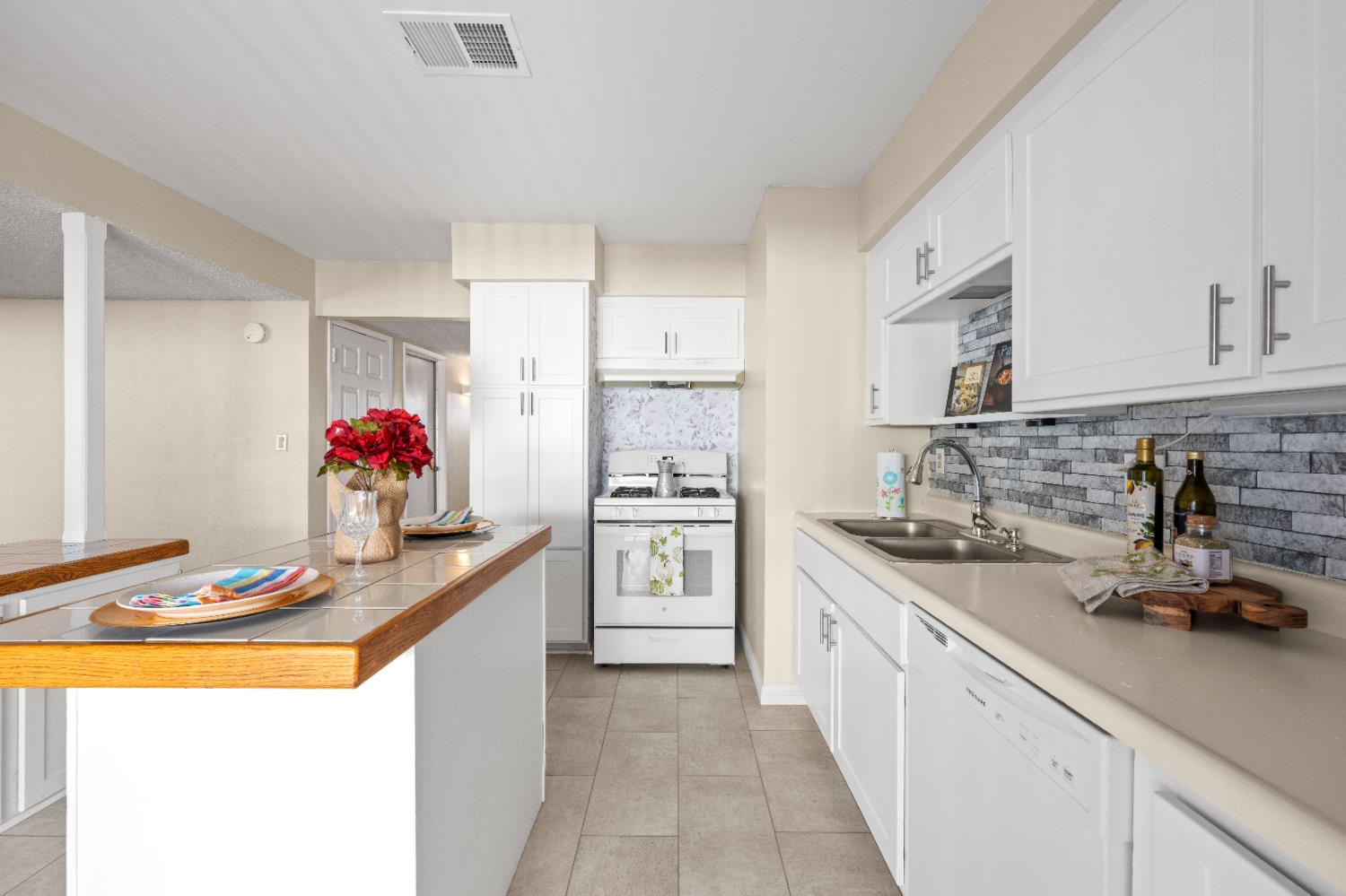 325 Archway Avenue Rio Linda, CA 95673 - Photo 5 of 29 a kitchen with stainless steel appliances granite countertop a sink and cabinets