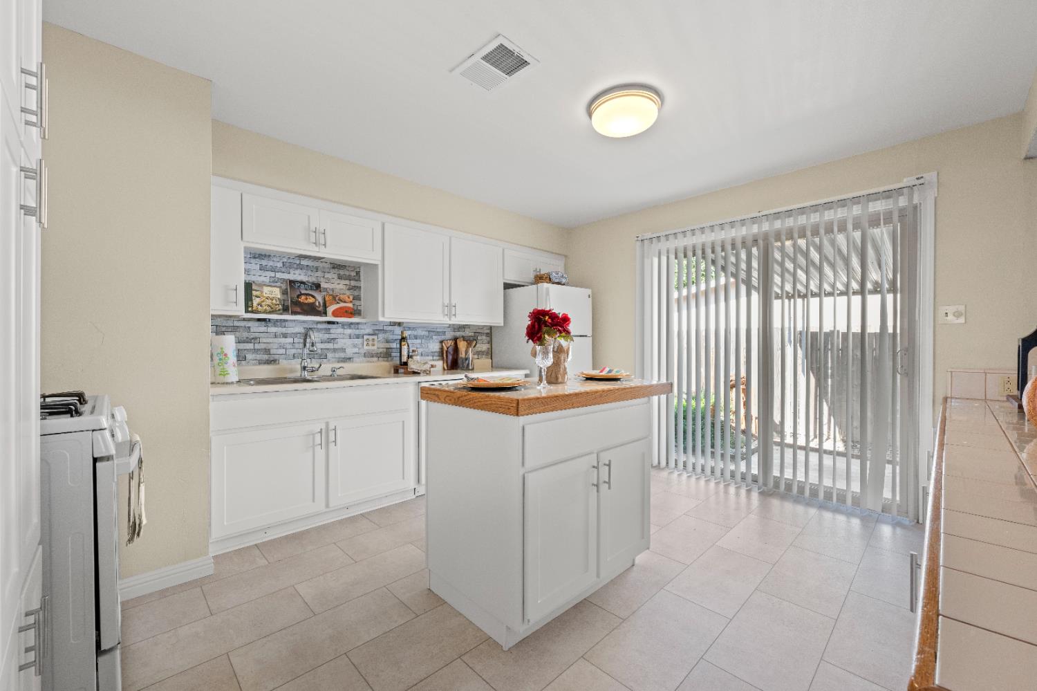 325 Archway Avenue Rio Linda, CA 95673 - Photo 8 of 29 a kitchen with cabinets and window