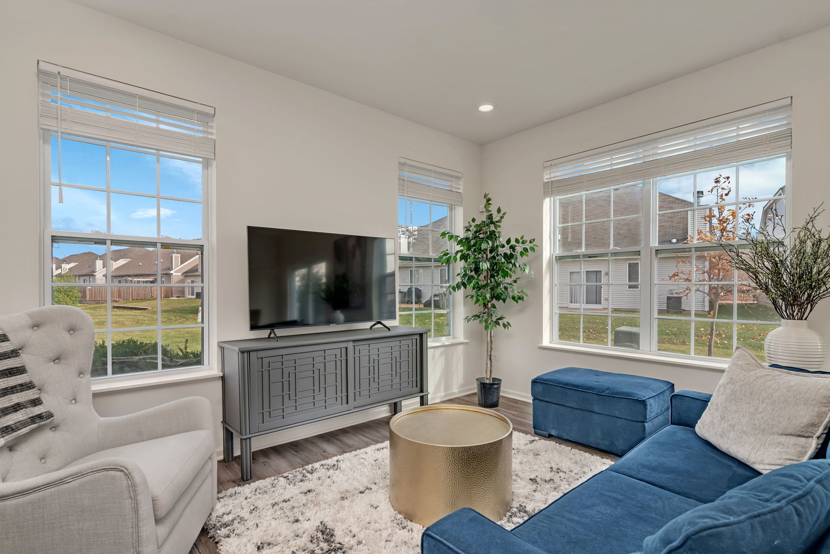 2108 Pembridge Lane Joliet, IL 60431 - Photo 14 of 35 a living room with furniture a flat screen tv and a large window