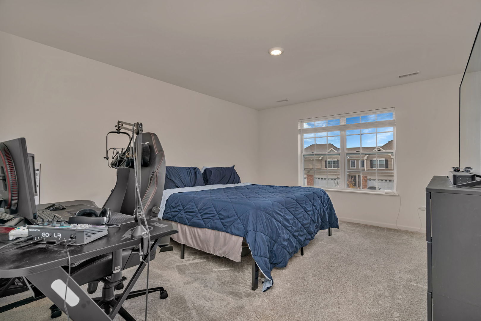 2108 Pembridge Lane Joliet, IL 60431 - Photo 20 of 35 a bedroom with a bed and large windows