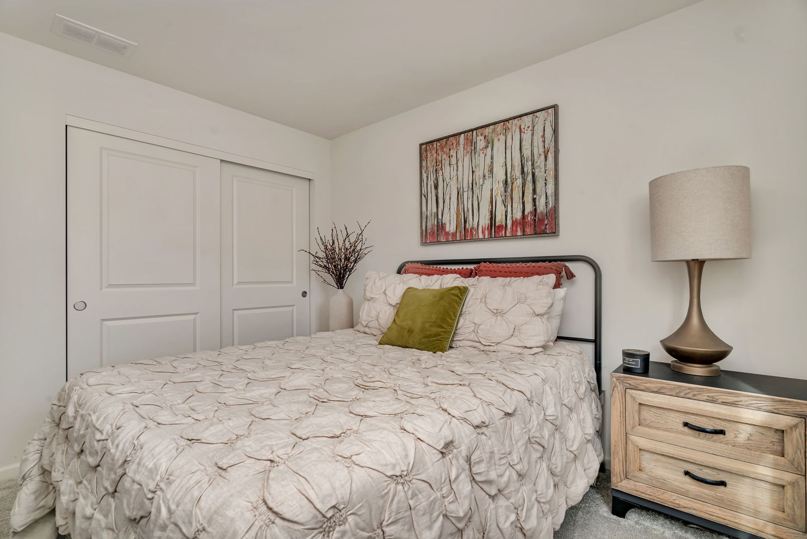 2108 Pembridge Lane Joliet, IL 60431 - Photo 28 of 35 a bedroom with a large bed and a lamp on dresser