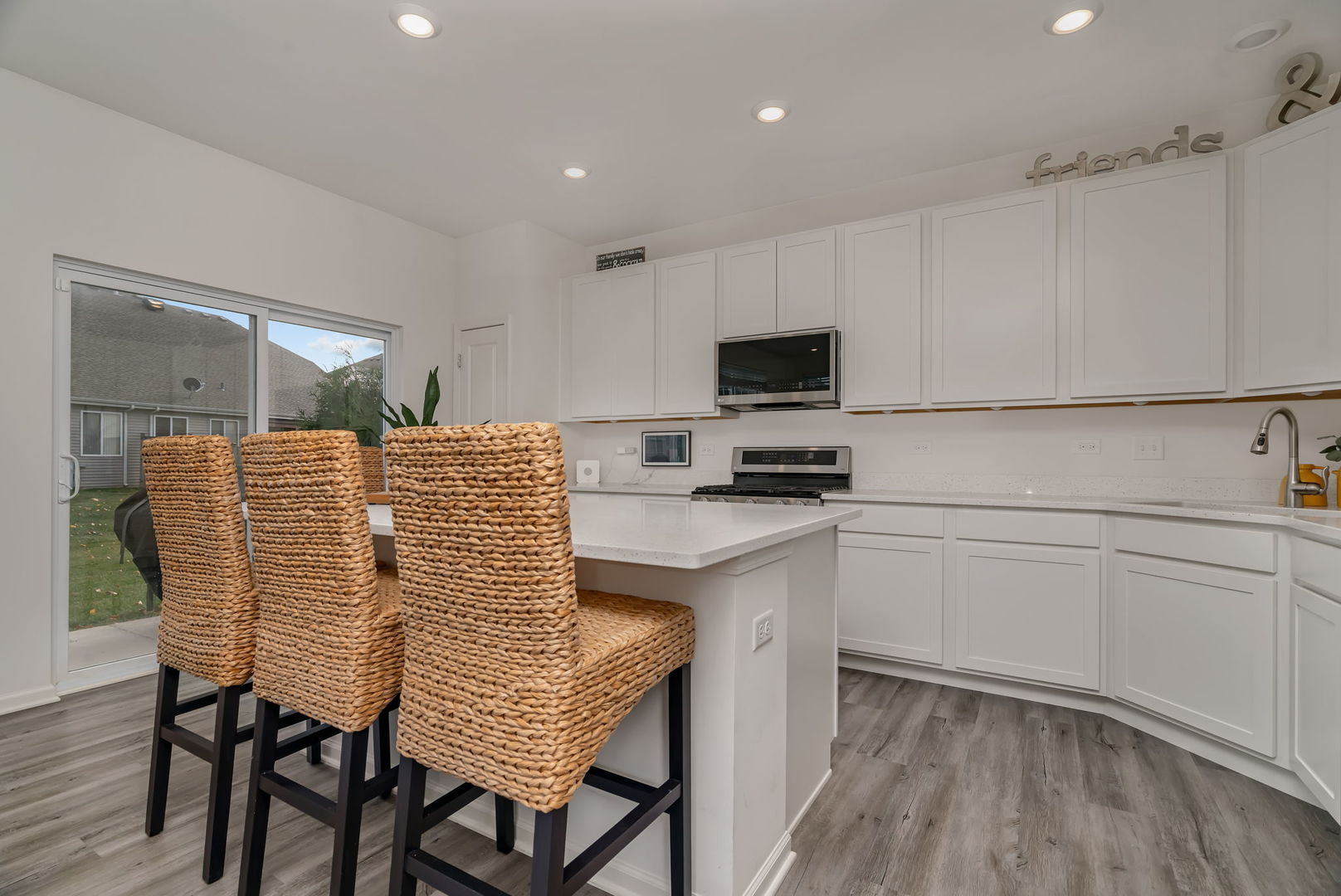 2108 Pembridge Lane Joliet, IL 60431 - Photo 9 of 35 a kitchen with a chair and appliances