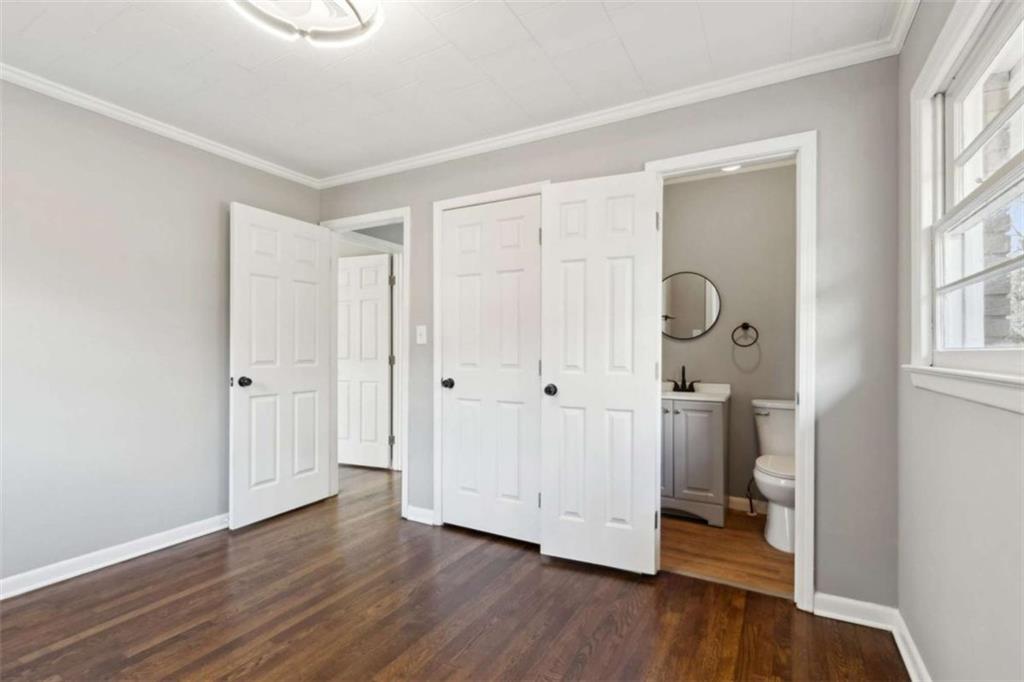 269 Elks Street Winder, GA 30680 - Photo 26 of 42 an empty room with wooden floor and windows