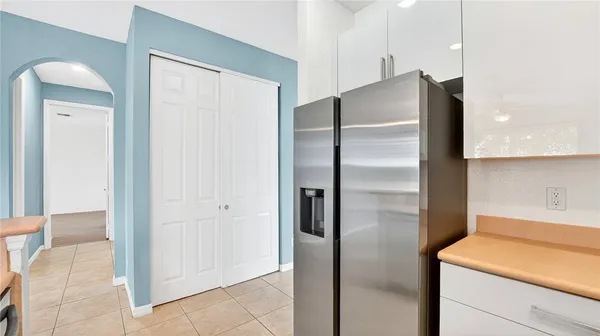 a view of a hallway with wooden floor and entryway