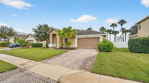 a front view of house with yard and green space