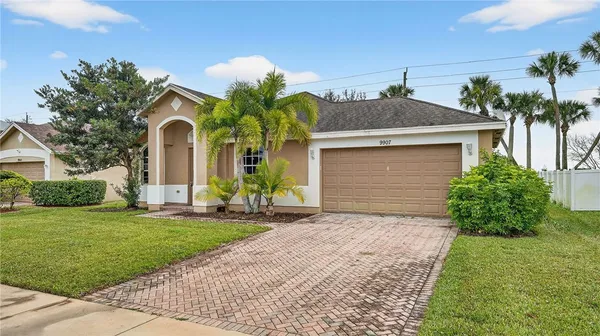 a front view of house with yard and green space