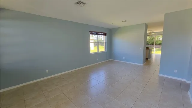 a kitchen with appliances a sink and cabinets