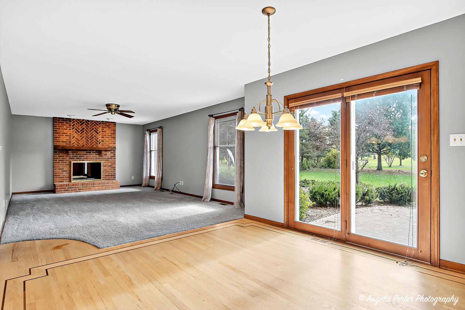 2215 Crystal Circle Crystal Lake, IL 60012 - Photo 14 of 58 a view of empty room with a fireplace and windows
