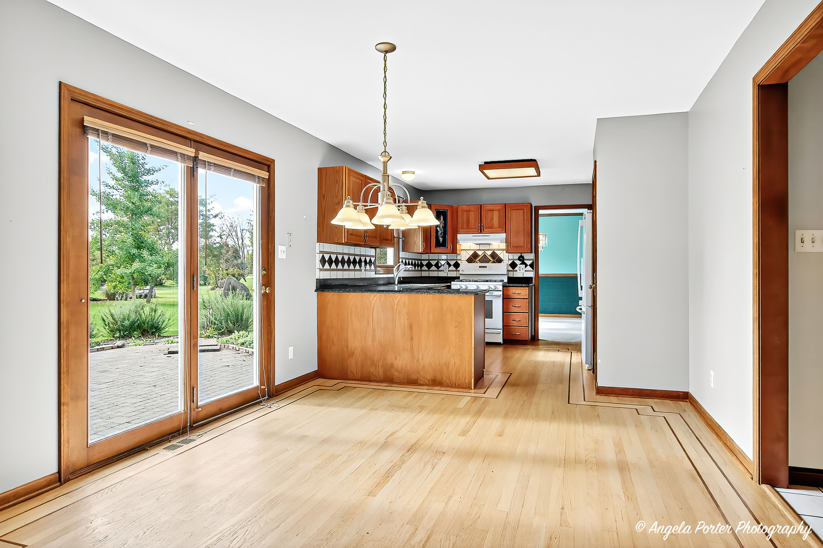 2215 Crystal Circle Crystal Lake, IL 60012 - Photo 16 of 58 a dining hall with stainless steel appliances granite countertop a refrigerator and microwave