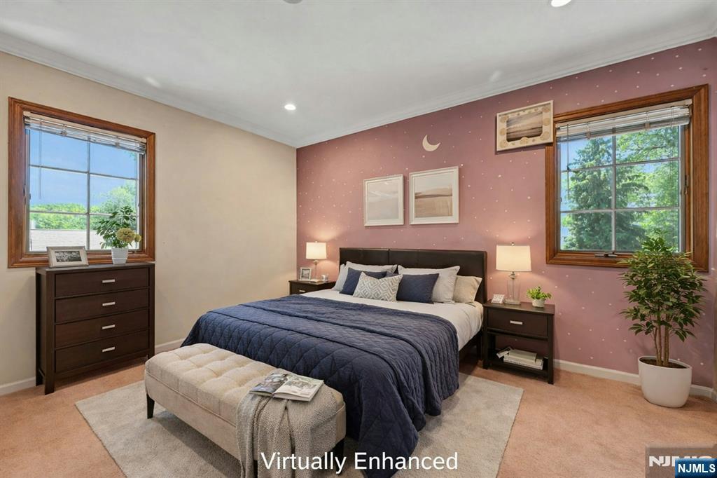 44 West Midland Avenue Paramus, NJ 07652 - Photo 18 of 19 a bedroom with a large bed and a potted plant