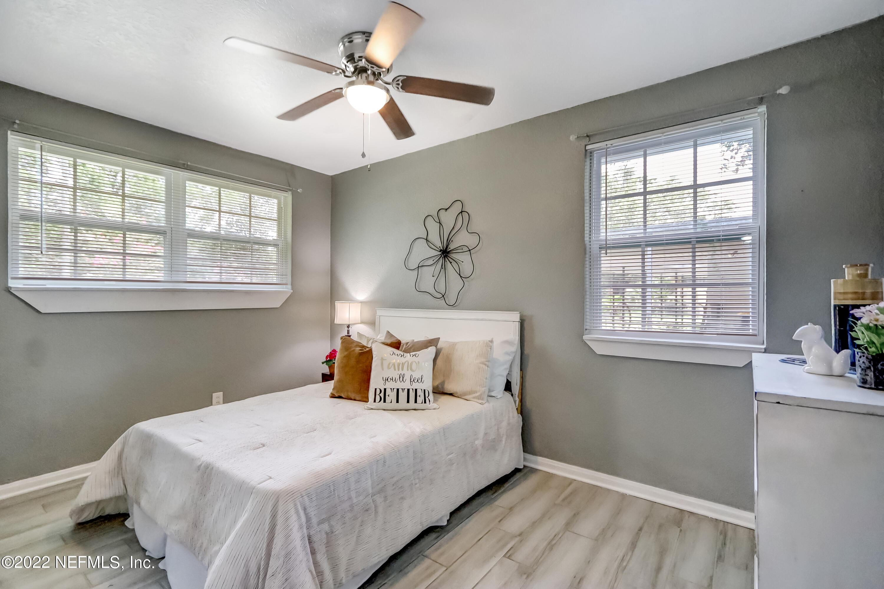 4816 Andromeda Road Jacksonville, FL 32210 - Photo 8 of 26 a bedroom with a large bed and a window